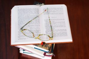 opened book glasses table 23 2147711462